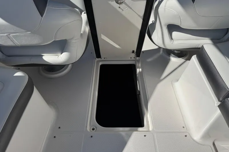 Slide: The Image of 2017 Chaparral 2870 SSX boat interior with open storage compartment. - 29