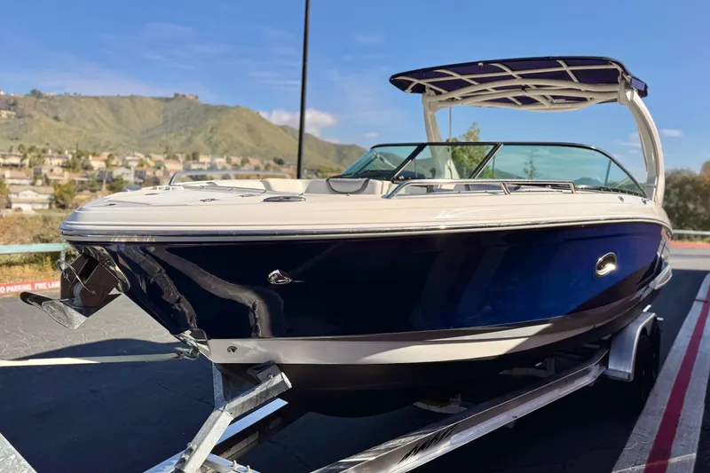 Slide: The Image of 2017 Chaparral 2870 SSX boat on trailer, scenic mountain backdrop. - 3