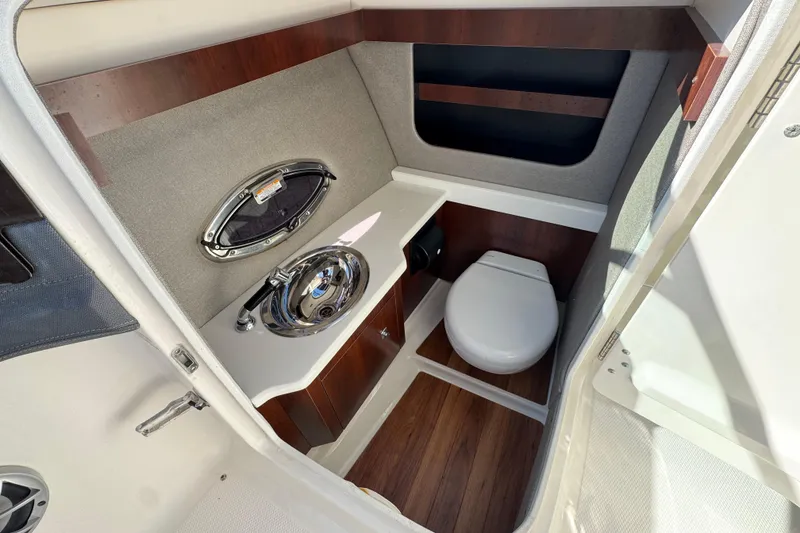 Slide: The Image of 2017 Chaparral 2870 SSX boat interior bathroom with sink and toilet. - 32
