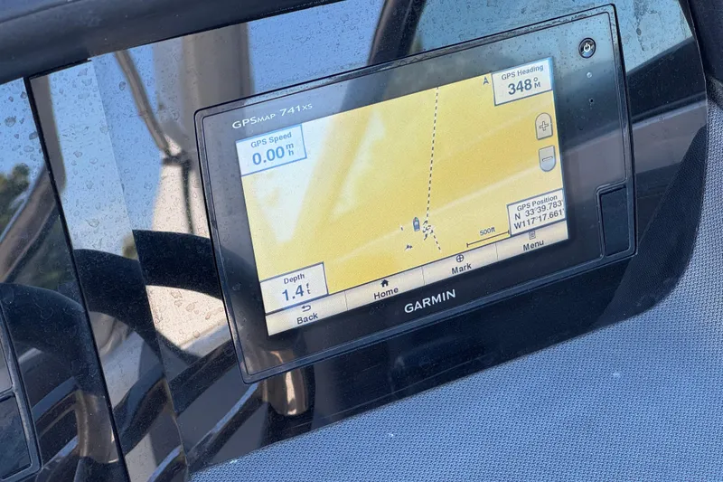 Slide: The Image of Garmin GPS display on 2017 Chaparral 2870 SSX boat dashboard, showing navigation details. - 35