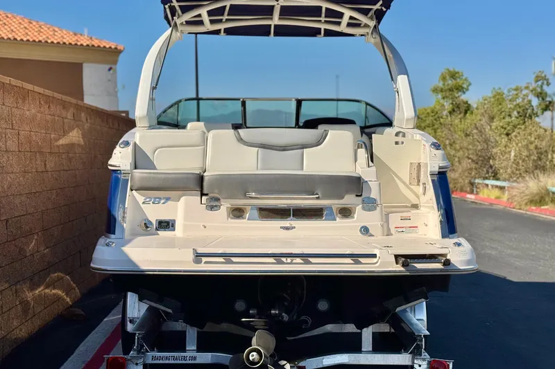 Slide: The Image of 2017 Chaparral 2870 SSX boat on trailer, rear view, sunny day. - 4