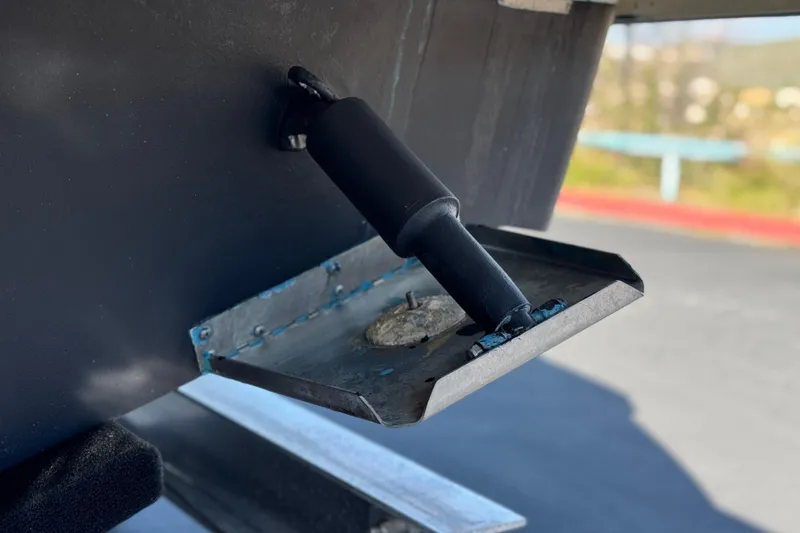 Slide: The Image of Trim tab of a 2017 Chaparral 2870 SSX boat, close-up view. - 9