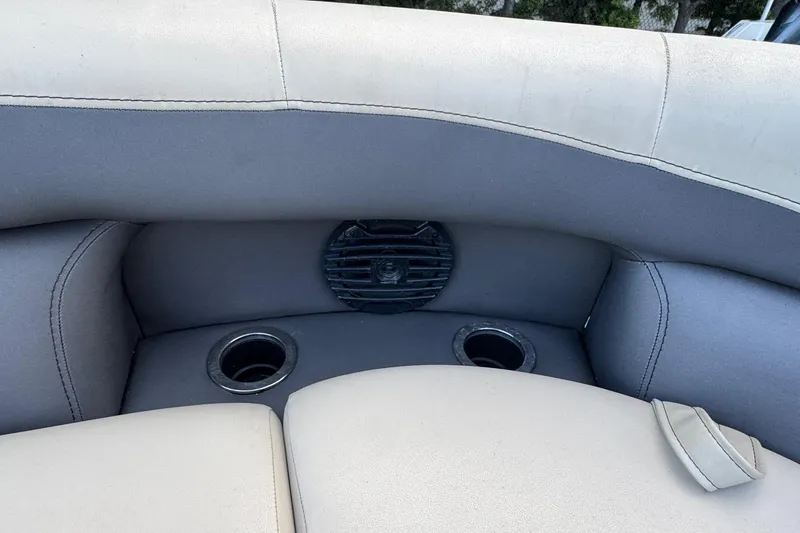 Slide: The Image of 2023 Barletta ARIA 22QC boat interior with cup holders and speaker. - 25
