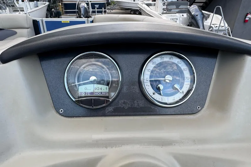 Slide: The Image of Dashboard of 2023 Barletta ARIA 22QC boat with gauges displaying RPM and speed. - 42