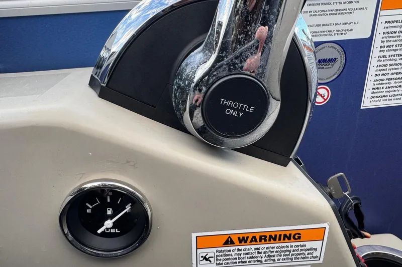 Slide: The Image of Throttle control and fuel gauge on 2023 Barletta ARIA 22QC boat dashboard. - 46