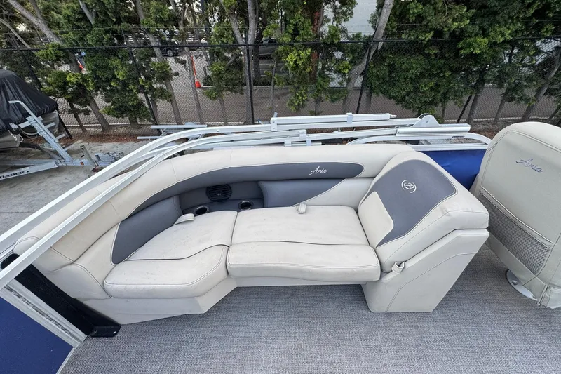 Slide: The Image of 2023 Barletta ARIA 22QC boat seating area with plush, light-colored upholstery. - 52