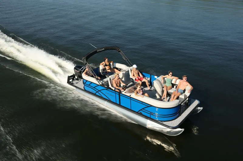 The Image of Sylvan Mirage X3 DH 2026 pontoon boat on water with passengers. - 0