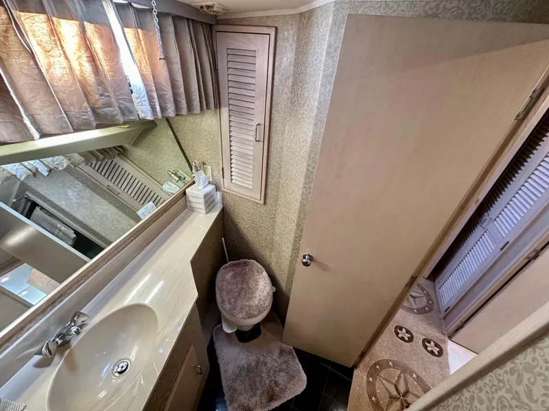 Slide: The Image of 1993 Tollycraft 57 Pilothouse bathroom interior view. - 16