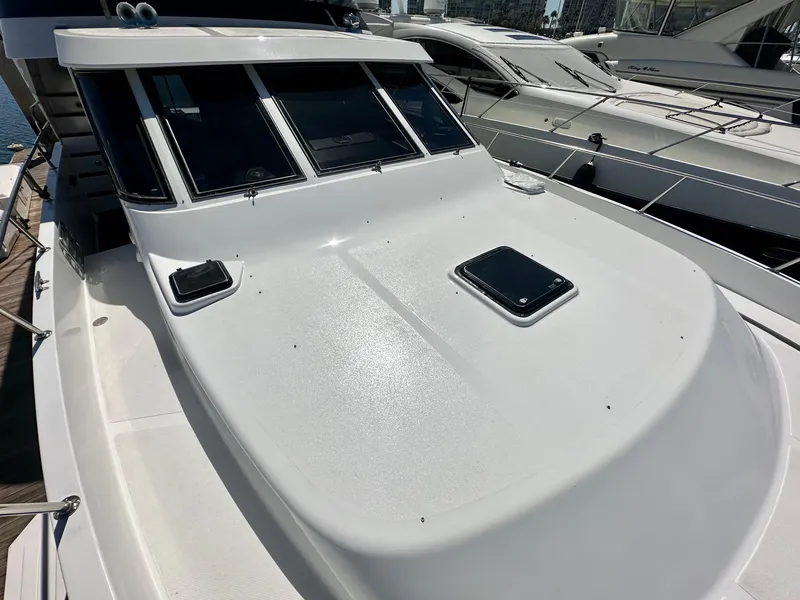 Slide: The Image of 1993 Tollycraft 57 Pilothouse on a dock, front deck view. - 30