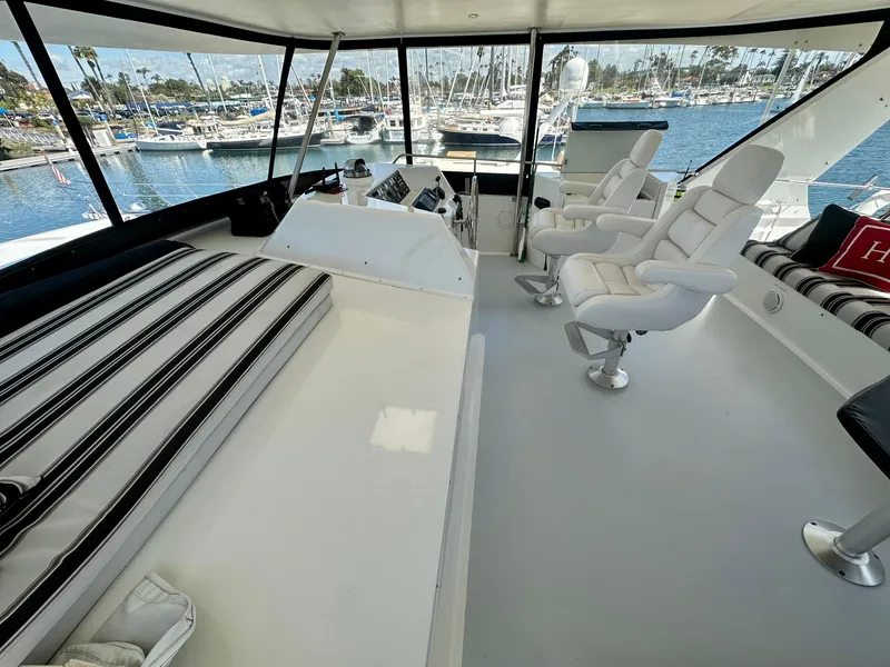 Slide: The Image of Interior of 1993 Tollycraft 57 Pilothouse yacht with white seating. - 21