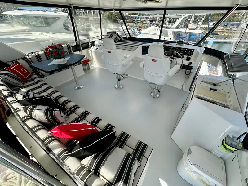 Slide: The Image of Interior of a 1993 Tollycraft 57 Pilothouse yacht with luxurious seating. - 25