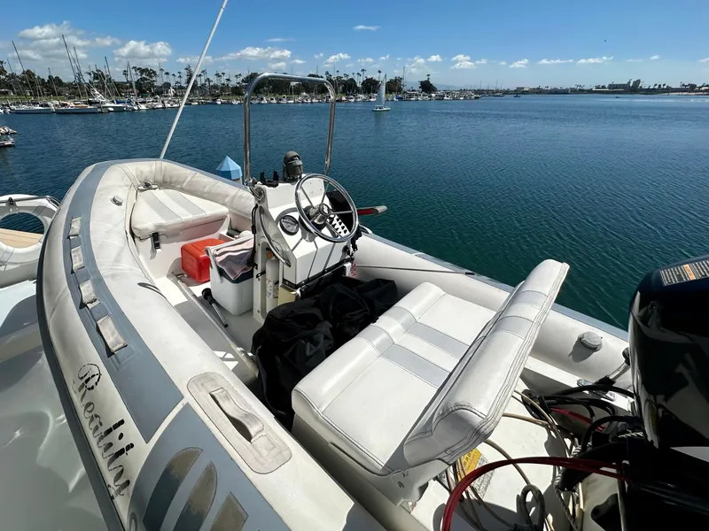 Slide: The Image of Tender on Tollycraft 57 Pilothouse yacht, 1993, docked in harbor. - 26