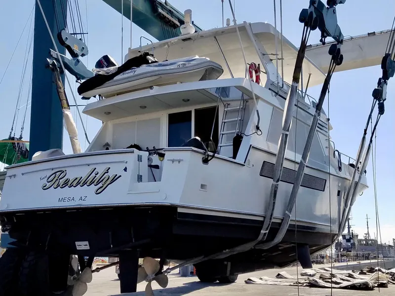 Slide: The Image of 1993 Tollycraft 57 Pilothouse on a boat lift. - 34