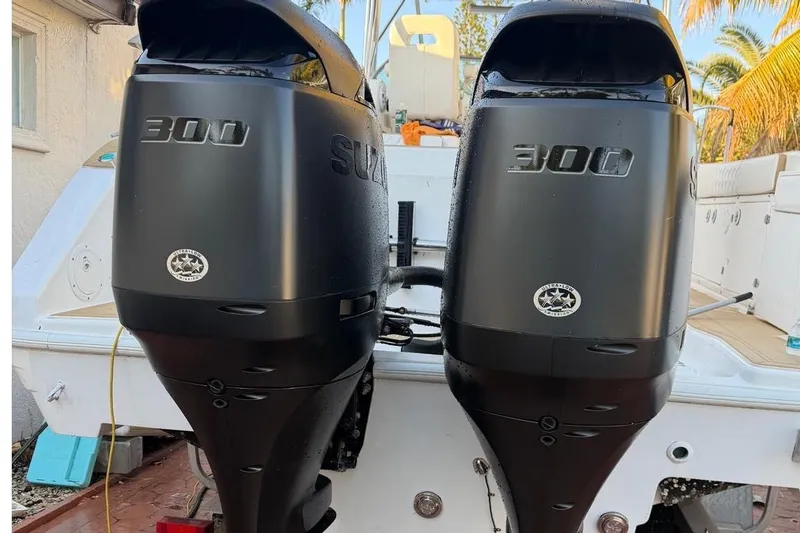 Slide: The Image of Twin Suzuki 300 outboard engines on a 2000 Century 3100 Walk-Around boat. - 17