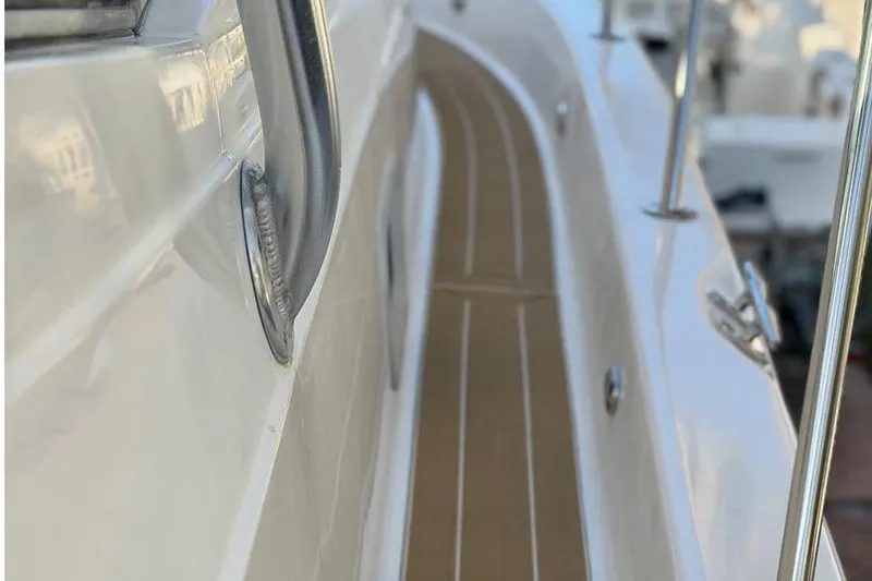 Slide: The Image of 2000 Century 3100 Walk-Around boat deck with stainless steel railing. - 27