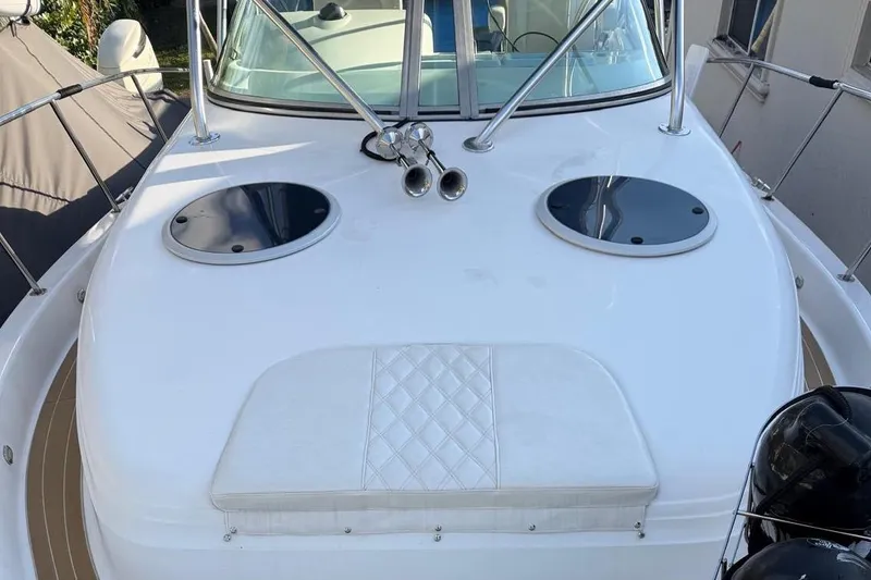 Slide: The Image of Century 3100 Walk-Around 2000 boat deck with seating and hatch covers. - 32