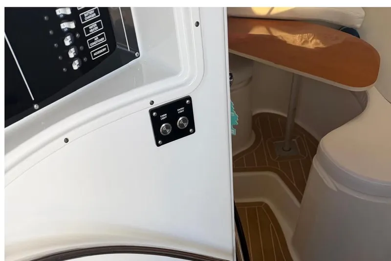 Slide: The Image of Interior view of a 2000 Century 3100 Walk-Around boat cabin with control panel. - 33