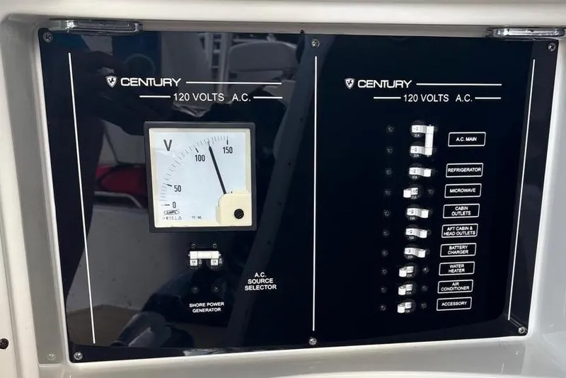 Slide: The Image of Century 3100 Walk-Around 2000 model electrical panel with voltmeter and circuit breakers. - 34