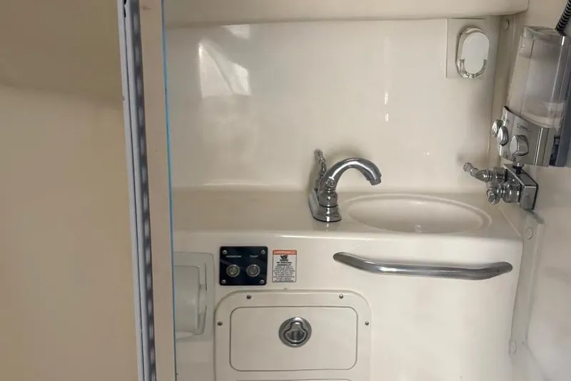 Slide: The Image of 2000 Century 3100 Walk-Around boat interior sink and faucet setup. - 41