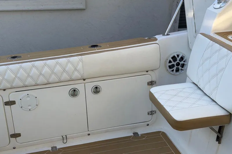 Slide: The Image of Century 3100 Walk-Around 2000 boat interior with cushioned seating and storage compartments. - 8