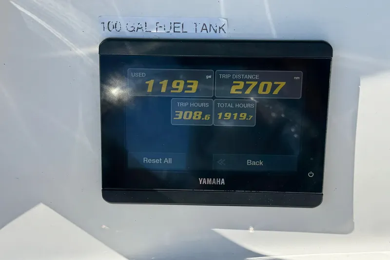 Slide: The Image of Yamaha display on 2023 NauticStar 242L Offshore showing fuel usage and trip data. - 39