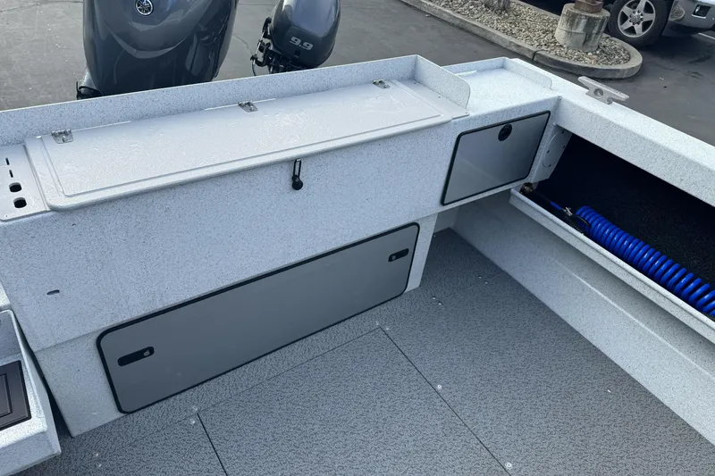 Slide: The Image of Interior of 2026 KingFisher 2025 Escape boat with storage compartments and coiled hose. - 12