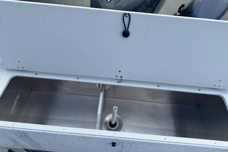 Slide: The Image of Open storage compartment in KingFisher 2025 Escape boat, showcasing interior design. - 13