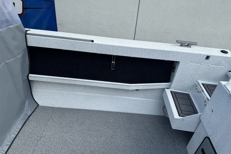 Slide: The Image of Interior view of 2026 KingFisher 2025 Escape boat, featuring storage compartments. - 14