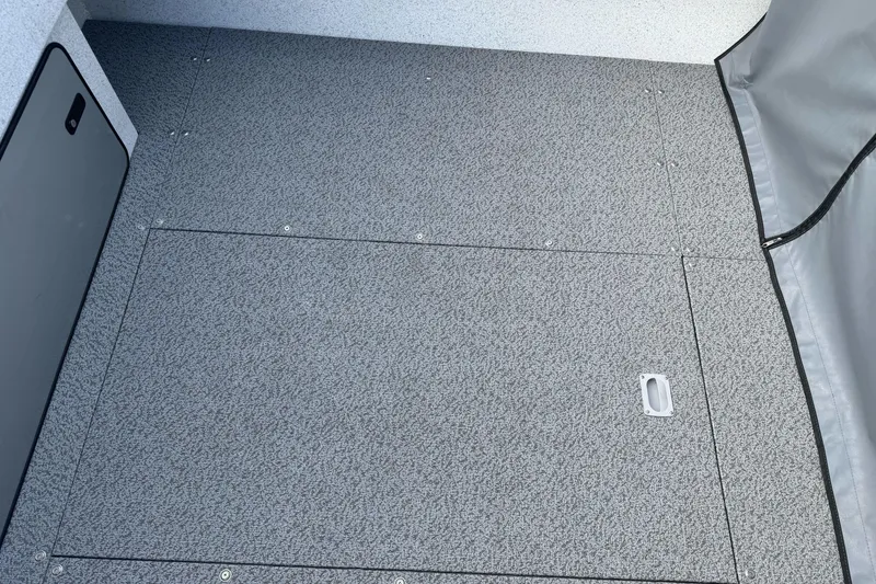 Slide: The Image of KingFisher 2025 Escape 2026 model interior with textured flooring and storage compartment. - 16