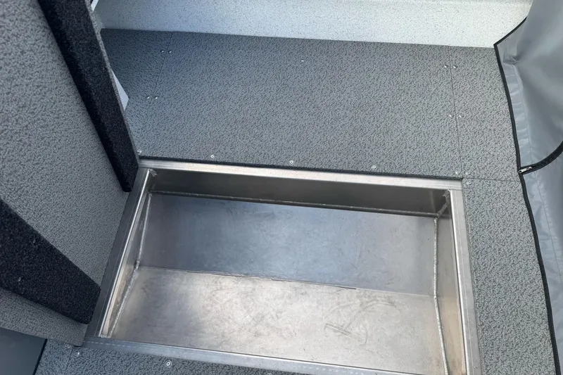 Slide: The Image of Interior view of 2026 KingFisher 2025 Escape boat, featuring a built-in storage compartment. - 17