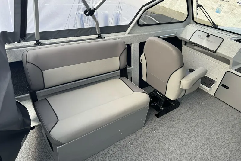 Slide: The Image of Interior of 2026 KingFisher 2025 Escape boat with gray seating and dashboard. - 20
