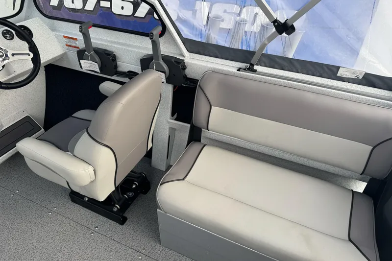 Slide: The Image of Interior of 2026 KingFisher 2025 Escape boat with seating and steering wheel. - 21