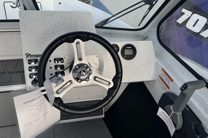 Slide: The Image of Steering console of 2026 KingFisher 2025 Escape boat with controls and gauges. - 26