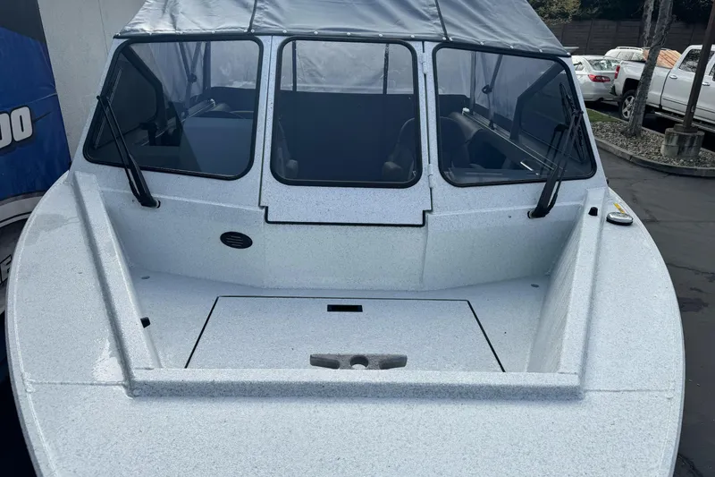 Slide: The Image of KingFisher 2025 Escape boat, 2026 model, with windshield and covered cabin. - 6