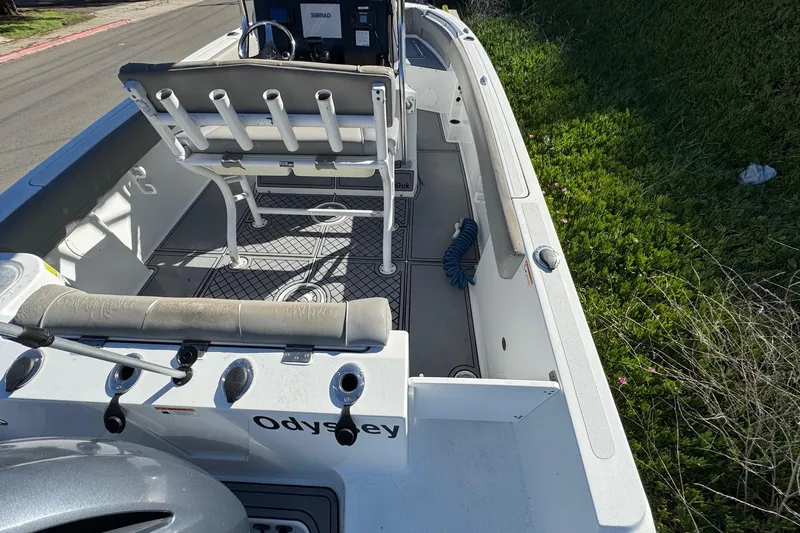 Slide: The Image of 2020 Wellcraft 222 Fisherman boat interior with seating and fishing rod holders. - 23