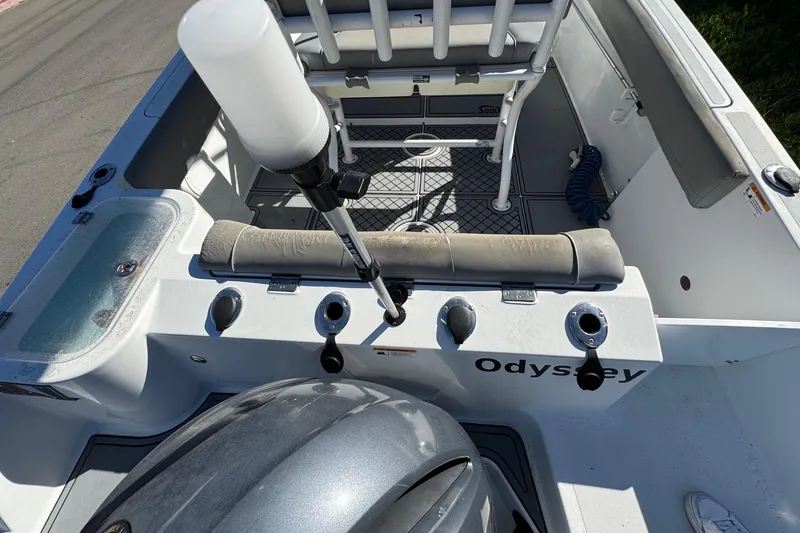Slide: The Image of 2020 Wellcraft 222 Fisherman boat interior with fishing rod holders and seating. - 24