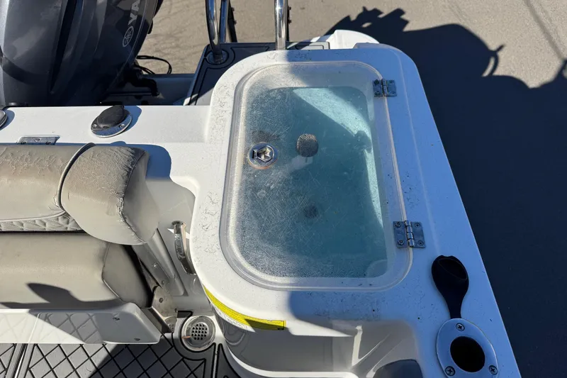 Slide: The Image of 2020 Wellcraft 222 Fisherman boat interior with seating and storage compartment. - 26