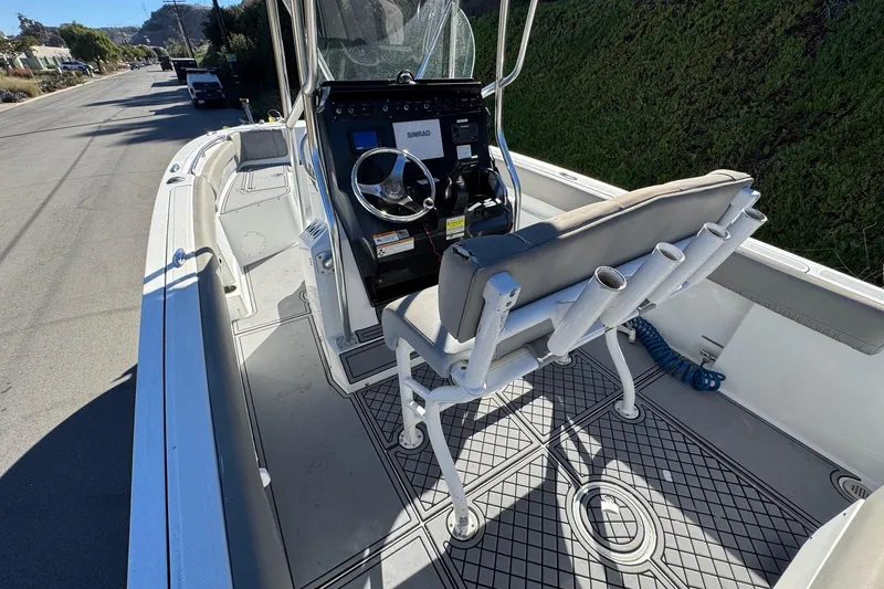 Slide: The Image of 2020 Wellcraft 222 Fisherman boat interior with steering console and seating. - 31