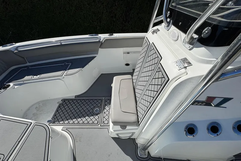 Slide: The Image of 2020 Wellcraft 222 Fisherman boat interior with seating and storage compartments. - 44