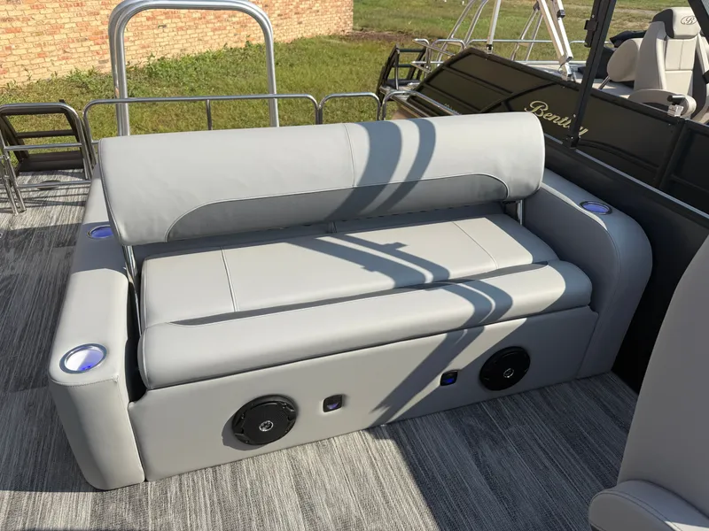 Slide: The Image of 2026 Bentley Pontoons Legacy 300HP Tritoon seating area with speakers. - 19