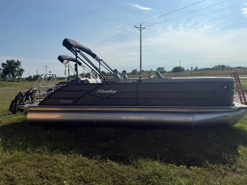 Slide: The Image of 2026 Bentley Pontoons Legacy Tritoon on grass in daylight. - 48