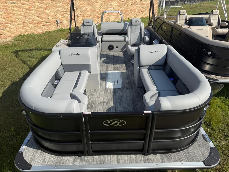 Slide: The Image of 2026 Bentley Pontoons Legacy 300HP Tritoon with gray seating. - 5