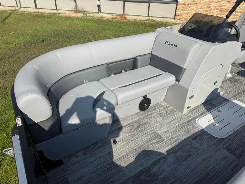 Slide: The Image of 2026 Bentley Pontoons Legacy 300HP Tritoon interior with gray upholstery. - 7