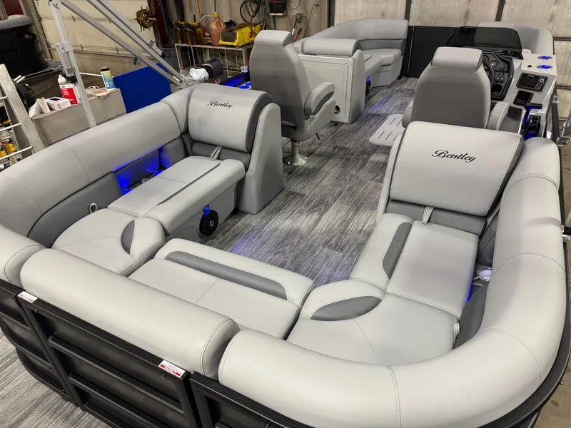 Slide: The Image of 2026 Bentley Pontoons Legacy Tritoon with luxurious gray leather seating. - 24