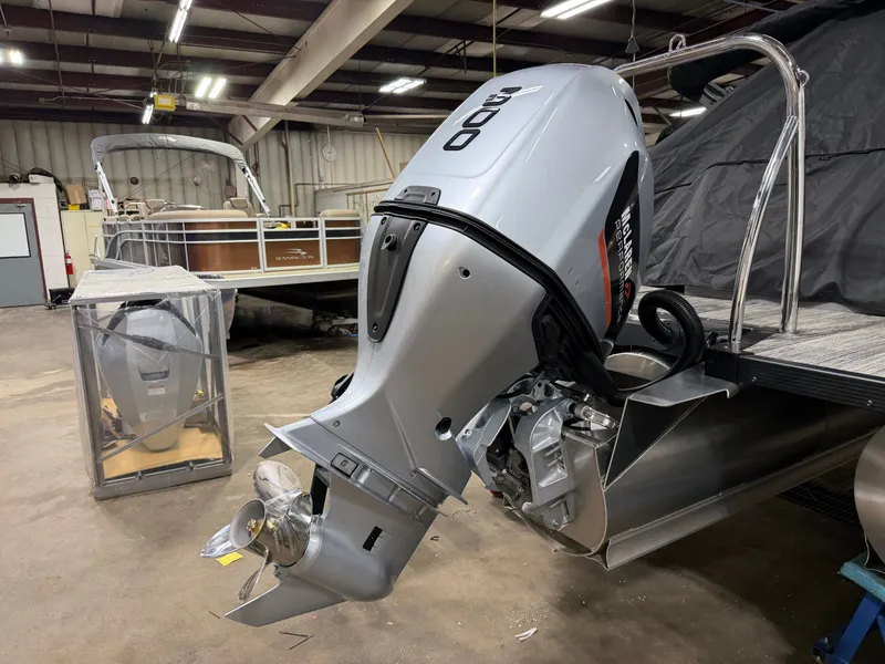 Slide: The Image of 2026 Bentley Pontoons Legacy Tritoon with 300HP engine in workshop. - 47