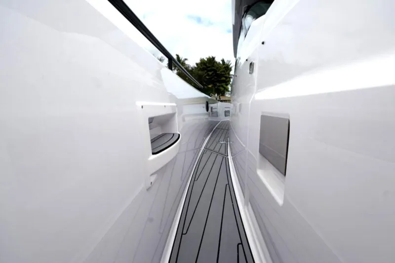 Slide: The Image of Side view of 2022 Axopar 37 Sun-Top yacht, showcasing sleek design and modern deck. - 16