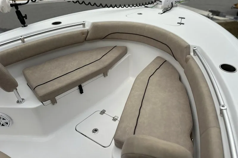 Slide: The Image of 2019 Sportsman Open 212 Center Console boat with beige cushioned seating. - 11