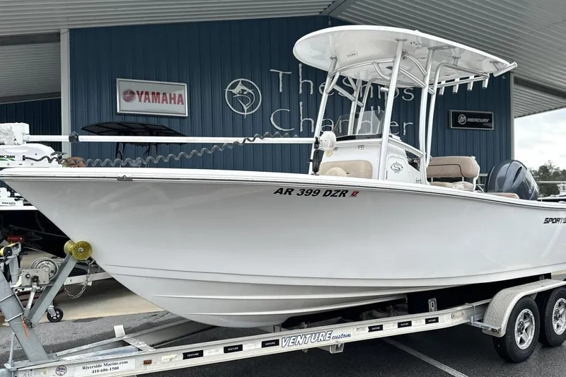 Slide: The Image of 2019 Sportsman Open 212 Center Console boat on trailer at dealership. - 2