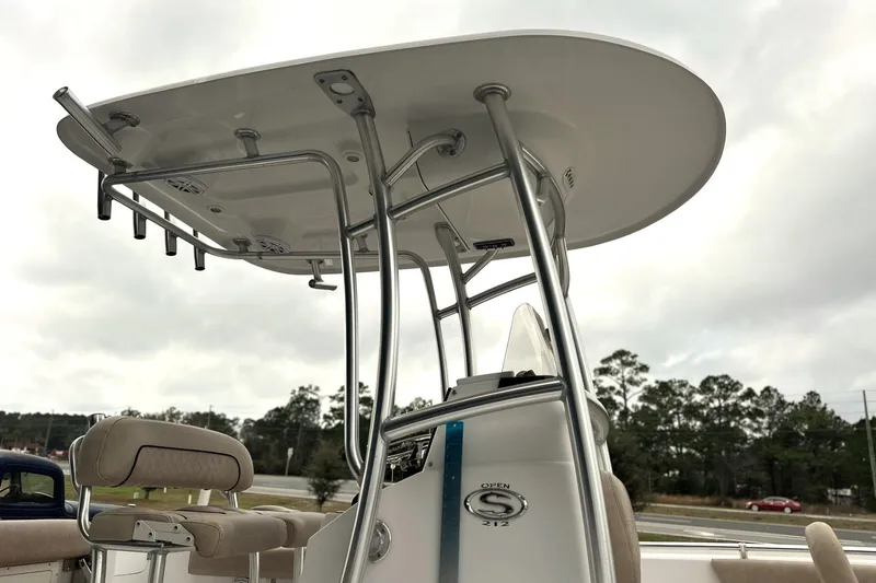 Slide: The Image of 2019 Sportsman Open 212 Center Console boat with T-top and seating, outdoors. - 3