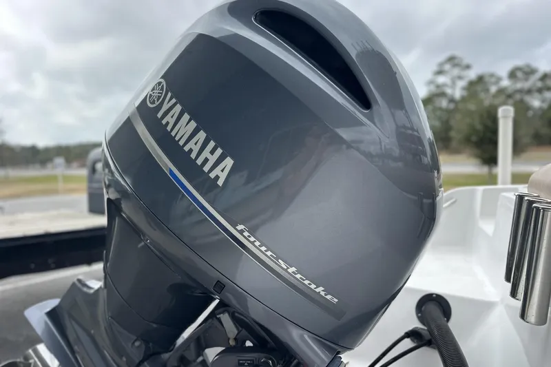 Slide: The Image of Yamaha four-stroke engine on 2019 Sportsman Open 212 Center Console boat. - 5
